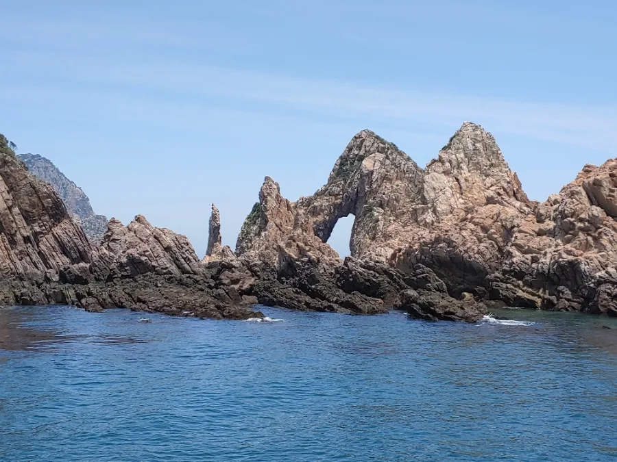 Rock stacks rising out of the water off the Heuksando coast, seen from the boat