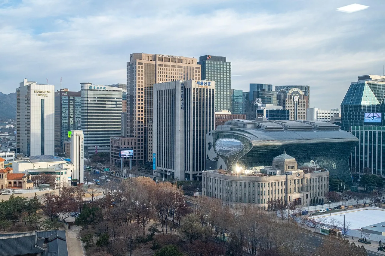 Office towers and an open plaza in central Seoul on a clear day