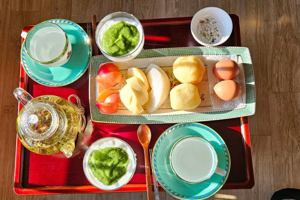 A hanok breakfast tray with tea, fruit and boiled eggs