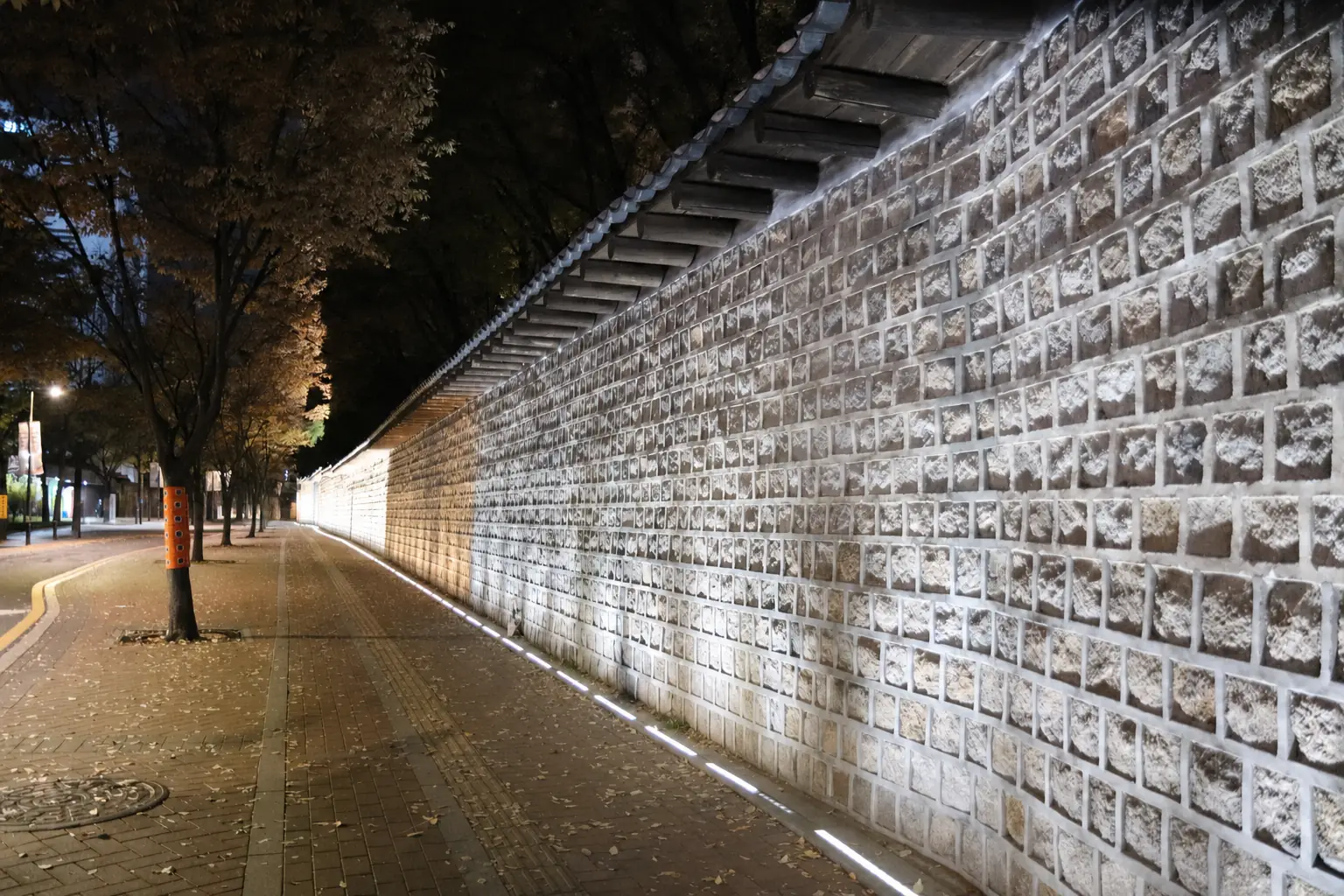 Lit palace wall in Seochon at night