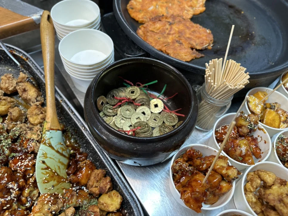 Brass tokens used for lunch at Tongin Market