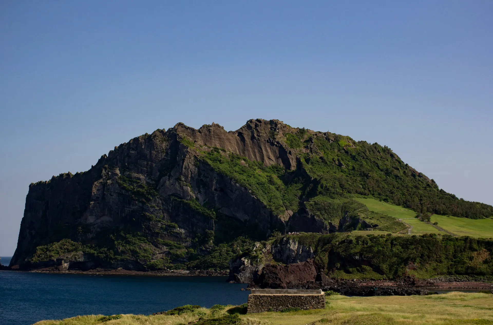 Seongsan Ilchulbong volcanic crater rising from the sea